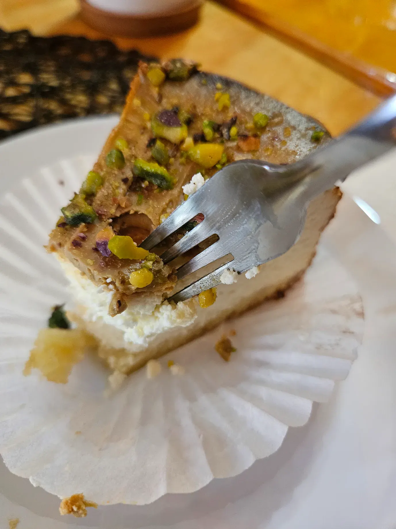 A slice of pistachio cheesecake